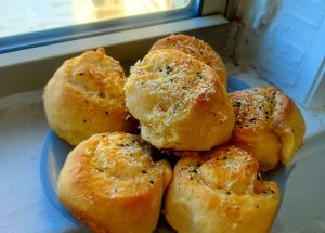 Cheesy cacio e pepe rolls, warm from the oven