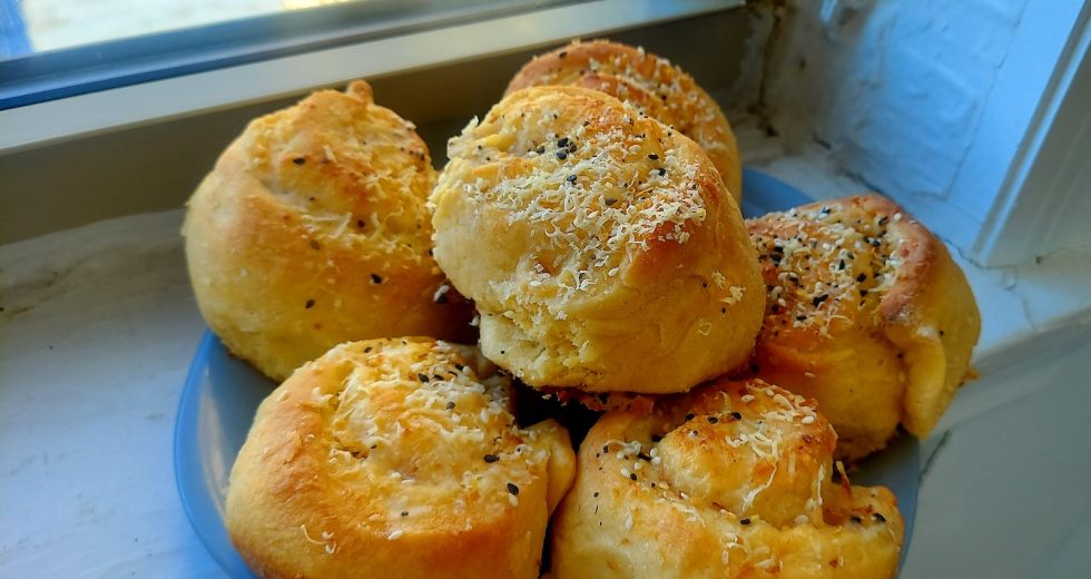Cheesy cacio e pepe rolls, warm from the oven